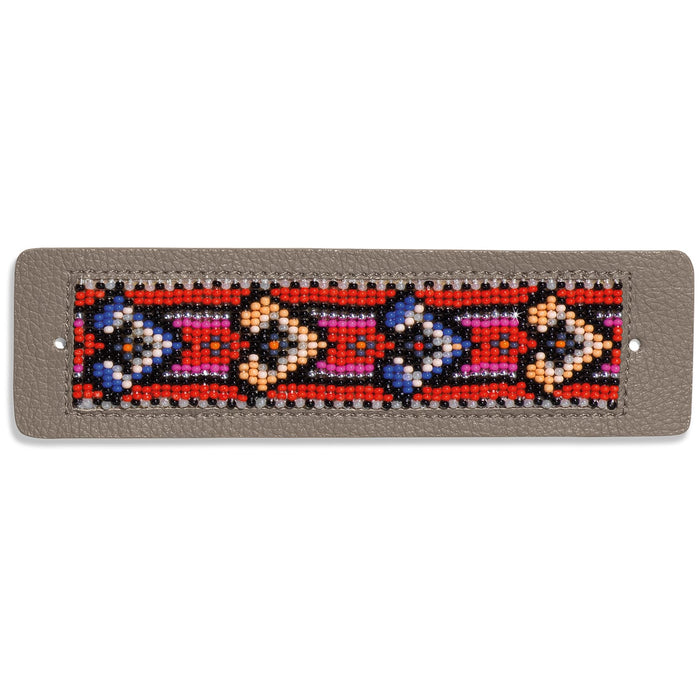 Brighton beaded cuff bracelet with red, blue, pink, and orange geometric pattern on gray leather on a white background