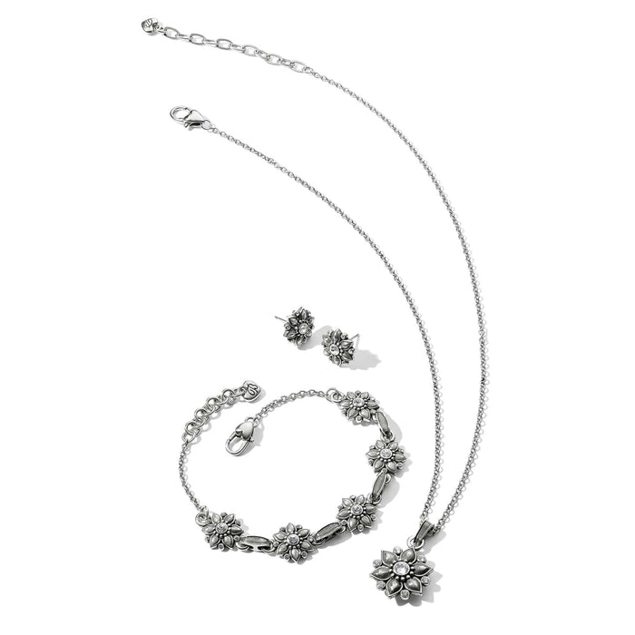 Brighton silver-plated floral jewelry set with necklace, bracelet, and stud earrings featuring crystal accents on white