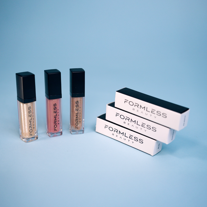 Formless Beauty lip products on a light blue background