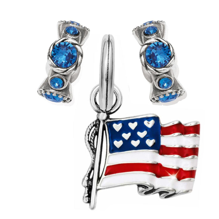 Brighton charms including blue crystal beads and an enameled American flag pendant with silver-plated finish on a white background