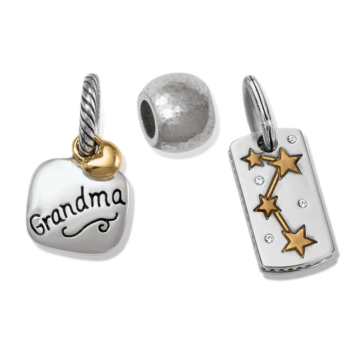 Brighton silver-plated charms including a Grandma heart tag, round bead, and star constellation pendant on a white background