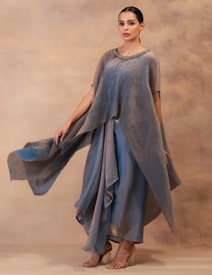 Model wearing the 'METALIC STEEL BLUE' Kaftan & Dhoti Set featuring intricate embroidery and luxurious fabric details in Singapore.