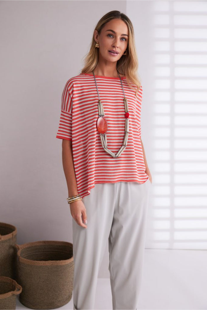 Model wearing Naya NPA26179 Slim Leg Trouser With Tab At Hem Ash in light ash color styled with a coral striped top and chunky necklace, shop Naya at Dotique.