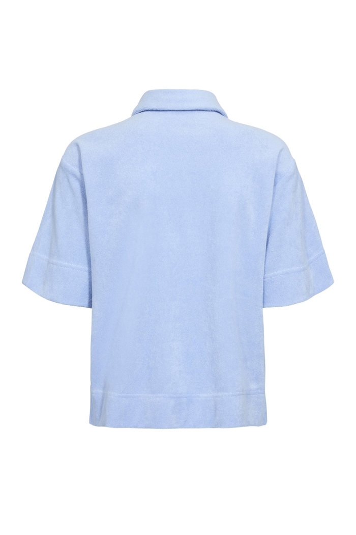 Back view of Numph 706802 Nualine Short Sleeve Shirt Placid Blue by Numph, featuring a relaxed fit and short sleeves. Shop Numph at Dotique.