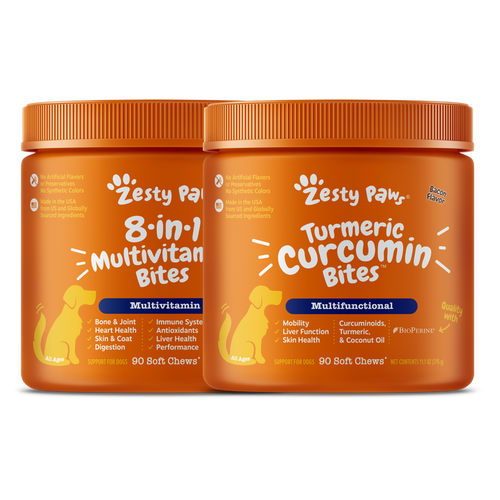 Two orange bottles of Zesty Paw dog supplements: 8-in-1 Multivitamin Bites and Turmeric Curcumin Bites, 90 soft chews each.