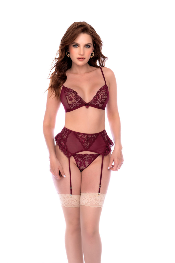 Three-piece set featuring a lace triangle bra, matching thong, and garter belt with adjustable straps. Soft and sultry with delicate lace detailing.