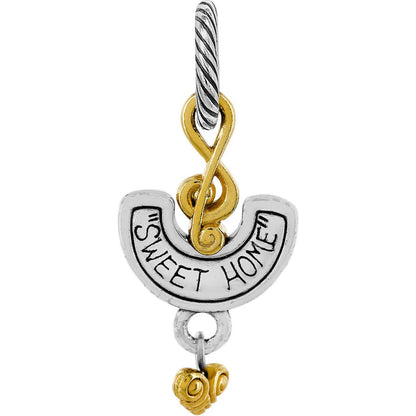 Brighton two-tone charm with engraved Sweet Home banner, gold infinity accent, and twisted silver-tone loop on a white background