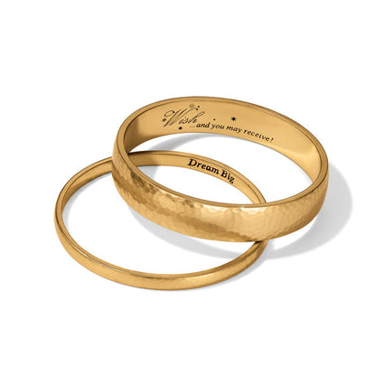 Brighton gold-tone bangle bracelet set with hammered finish and engraved Wish and Dream Big inscriptions on a white background