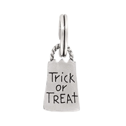 Brighton charm shaped like a silver-plated trick-or-treat bag with engraved Trick or Treat text on a white background