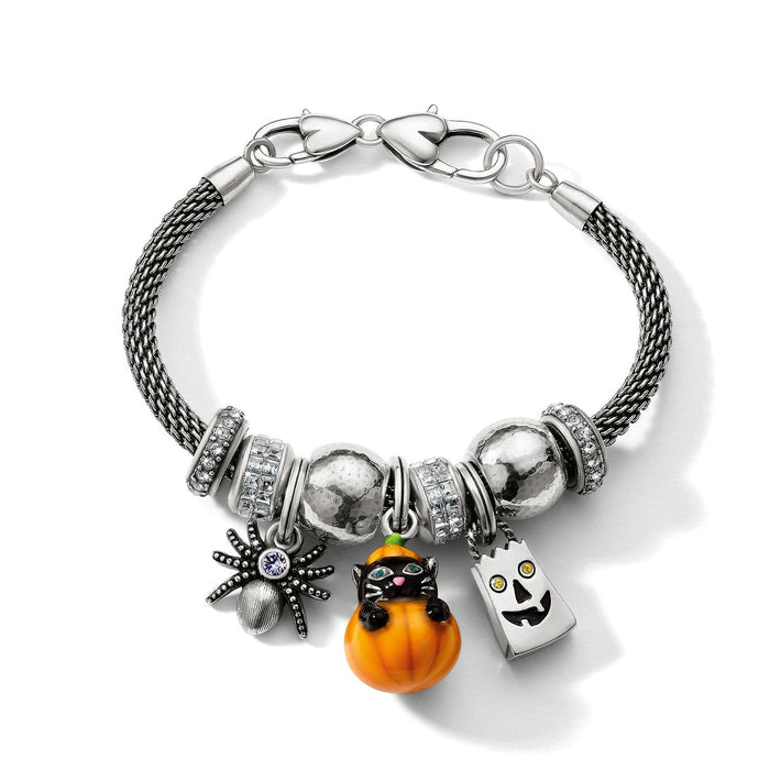 Brighton charm bracelet with silver-plated mesh band, crystal accents, spider, pumpkin cat, and ghost charms on a white background