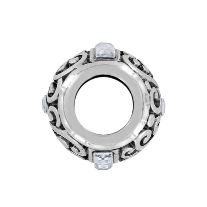 Brighton silver-plated spacer charm with scroll openwork design and crystal accents on a white background