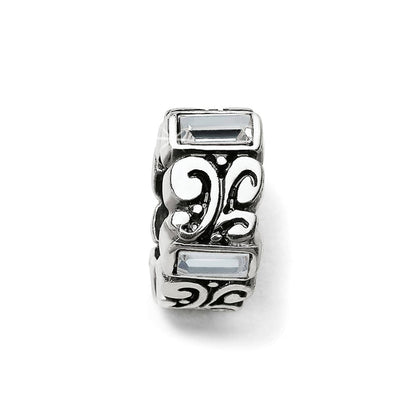 Brighton silver-plated spacer charm with scroll filigree design and clear crystal baguette accents on a white background