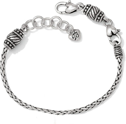 Brighton braided chain bracelet with silver-plated ornate beaded caps, lobster clasp, and heart charm on a white background