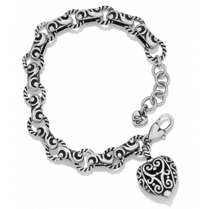 Brighton charm bracelet with silver-plated scrollwork links, ornate heart charm, and lobster clasp on a white background