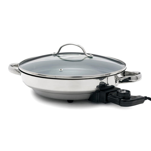 Stainless steel electric skillet with glass lid, side handles, and a built-in temperature control dial.