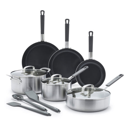12-piece stainless steel cookware set with lids and black utensils on a white background.