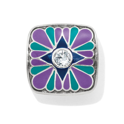 Brighton square charm with purple and teal enamel petals surrounding a blue star and crystal center on a white background
