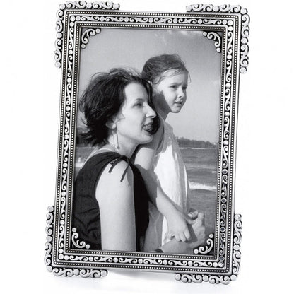 Brighton picture frame with silver-plated ornate scroll and beaded border holding a black and white photo on a white background