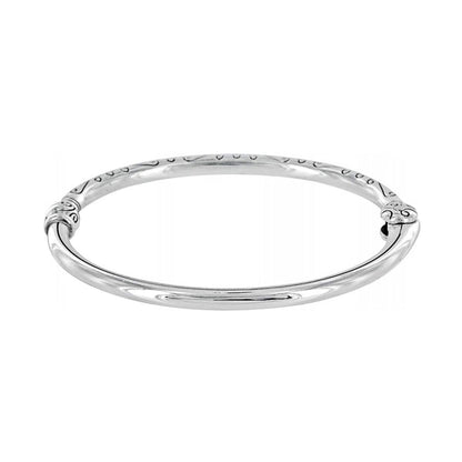 Brighton bangle bracelet with silver-plated finish and engraved scroll detailing along the top on a white background