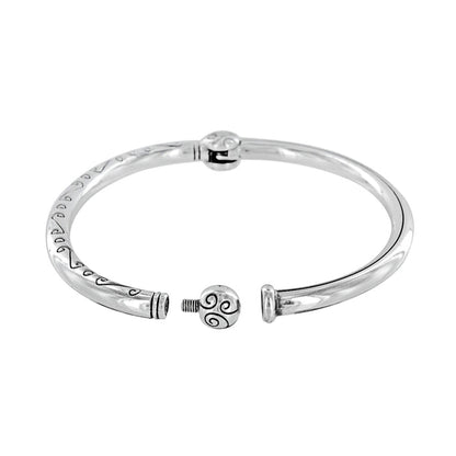 Brighton bangle bracelet shown open with silver-plated finish, engraved scroll detail, and decorative ball clasp on a white background