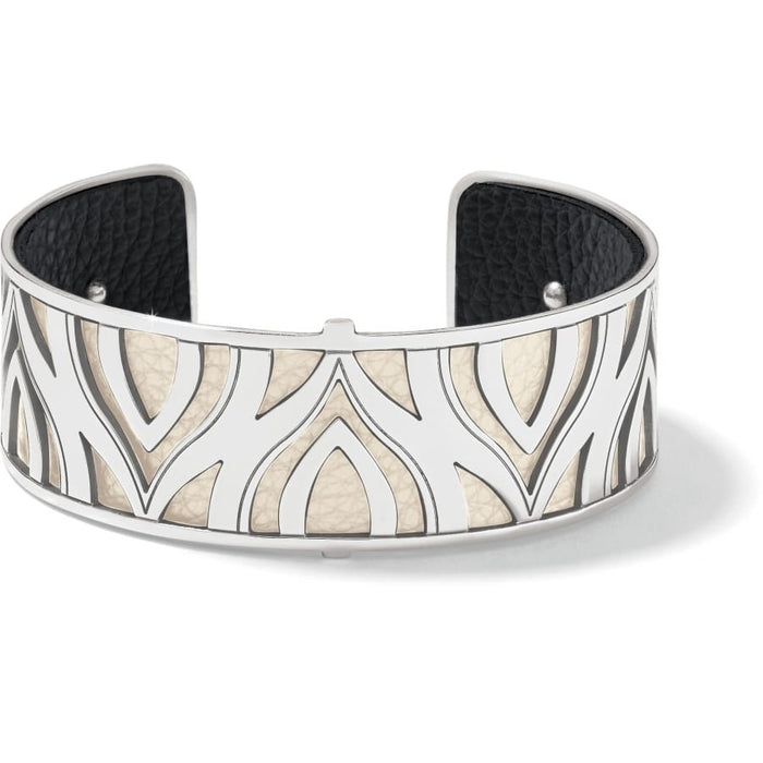 Brighton cuff bracelet with silver-plated cutout petal design over cream and black leather interior on a white background