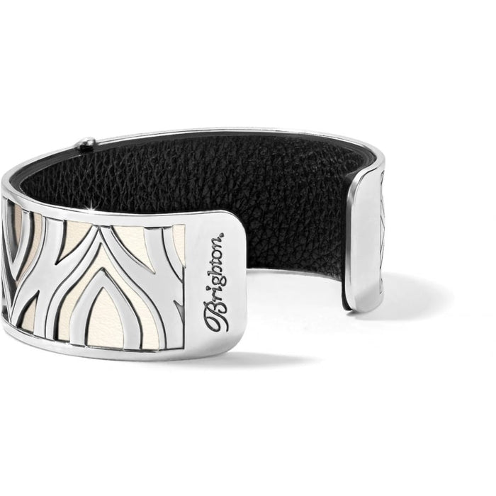 Brighton cuff bracelet with silver-plated cutout design, cream inlay, and black leather interior on a white background