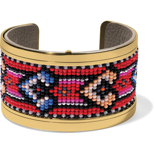 Brighton cuff bracelet with red, blue, pink, and black beaded geometric pattern and gold-tone frame on a white background