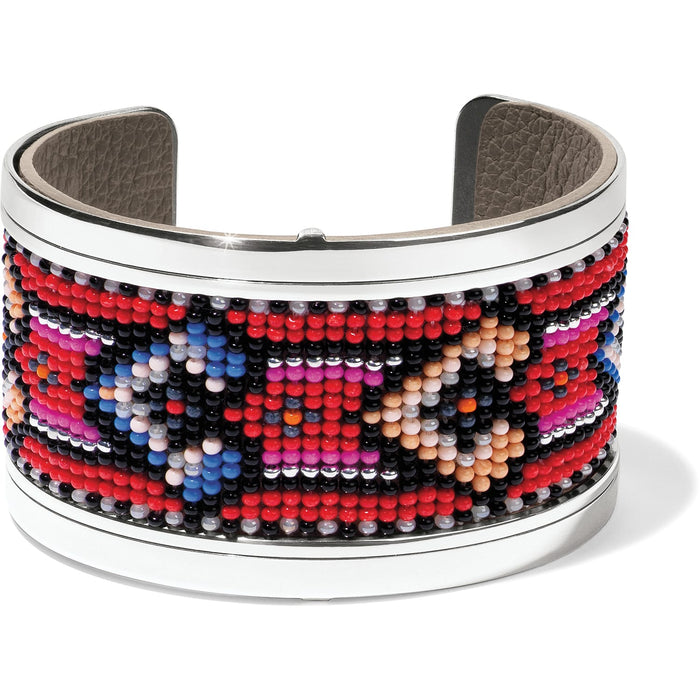 Brighton cuff bracelet with red, blue, and pink beaded geometric pattern and silver-tone frame on a white background