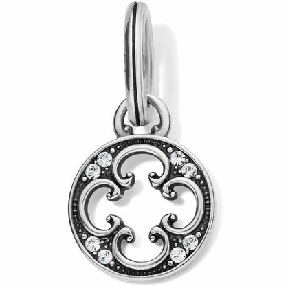 Brighton silver-plated charm with openwork scroll design, crystal accents, and split ring on a white background