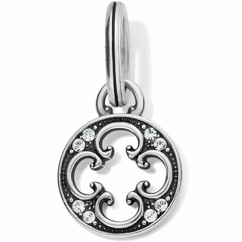 Brighton silver-plated charm with openwork scroll design, crystal accents, and split ring on a white background