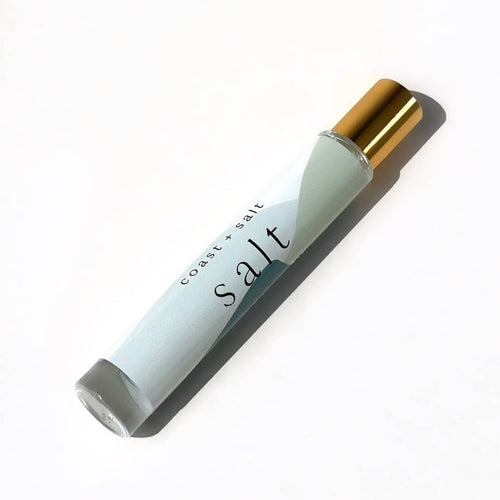 Roll-on bottle labeled 'salt' with a gold cap on a white background