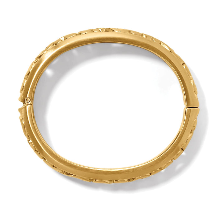 Brighton hinged bangle bracelet shown from the side with gold-plated finish and textured edge detail on a white background
