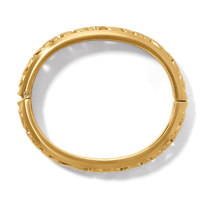 Brighton hinged bangle bracelet shown from the side with gold-plated finish and textured edge detail on a white background