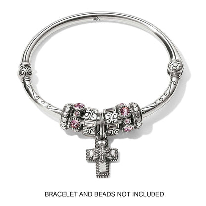 Brighton silver-plated cross charm with flower detail and crystal center, displayed on bangle with beads, on a white background