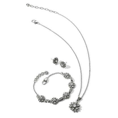 Brighton silver-plated floral jewelry set with necklace, bracelet, and stud earrings featuring crystal accents on white