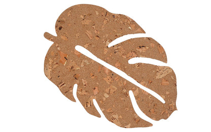 Cork coaster with leaf design on a white background