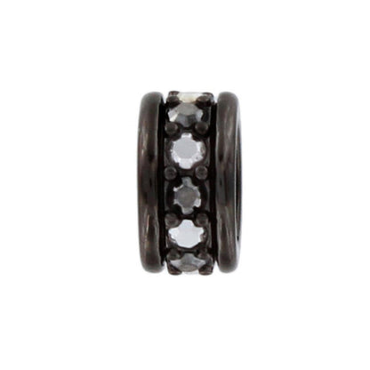 Brighton spacer charm with row of crystal stones set between dark metal banded edges on a white background