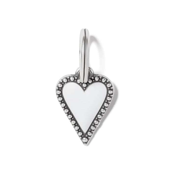 Brighton heart charm with white enamel center and silver-plated beaded border with split ring on a white background
