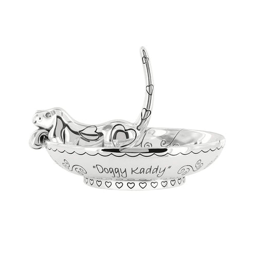 Brighton silver-plated ring holder dish with reclining dog figure, heart accents, and "Doggy Kaddy" engraving on a white background
