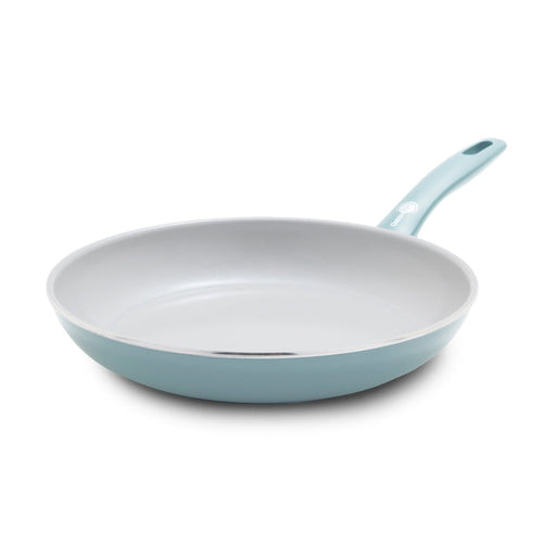 Blue frypan with white ceramic interior, 10-inch size. Handle attached, shown against a plain background.
