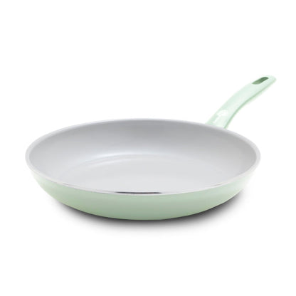 Pastel green ceramic nonstick 10-inch frypan with matching handle, displayed on a white background.