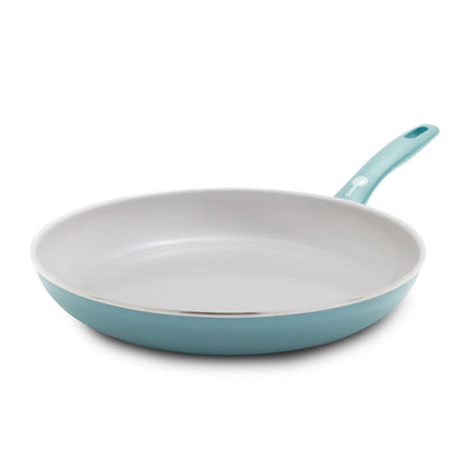 Blue haze ceramic 12-inch frypan with white interior and stay-cool handle on a white background.