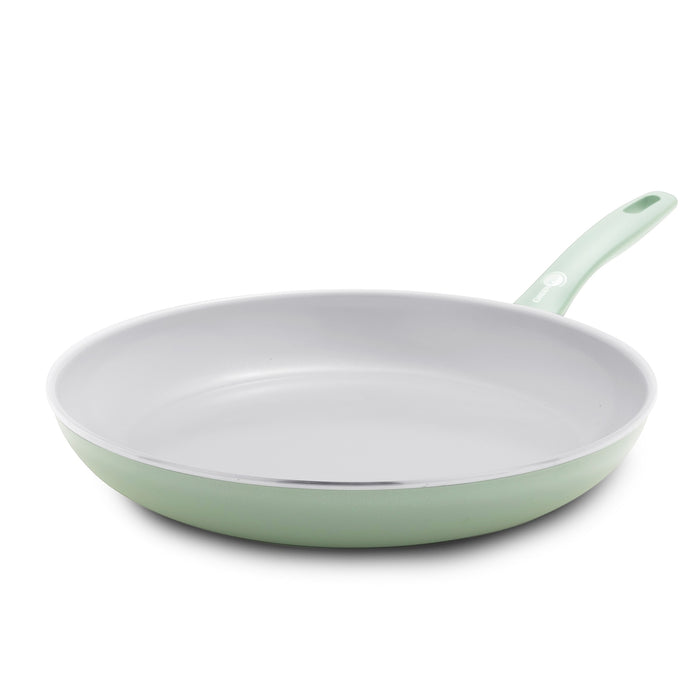 Pastel green 12-inch ceramic frypan with quick-heating aluminum base and angled stay-cool handle.