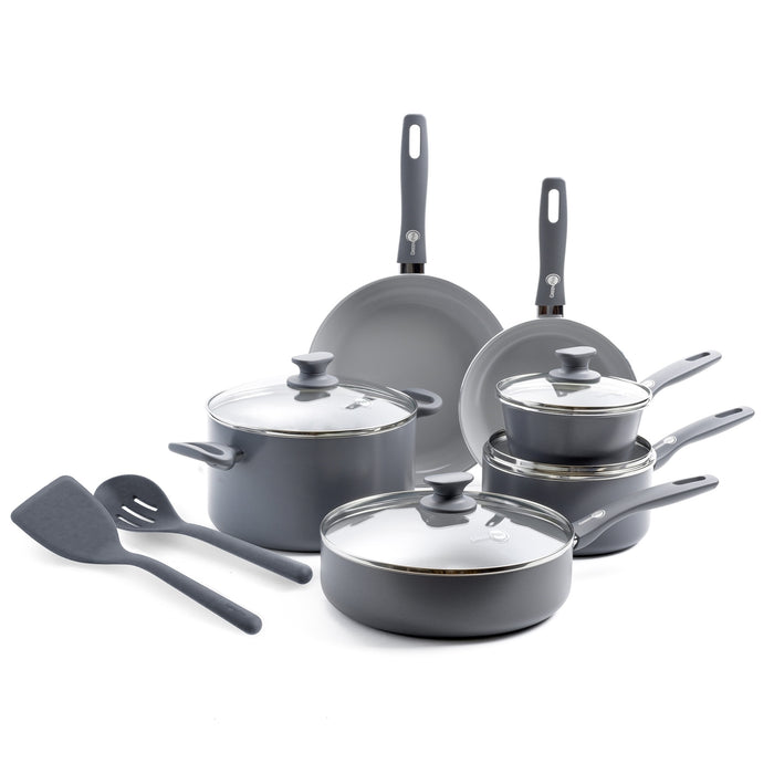Charcoal gray ceramic 12-piece cookware set with glass lids, pans, pots, and utensils displayed together.