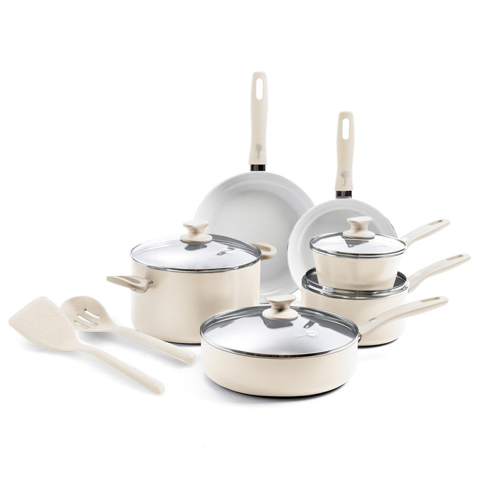 Cream white ceramic cookware set with pots, pans, lids, and utensils; 12 pieces displayed together.