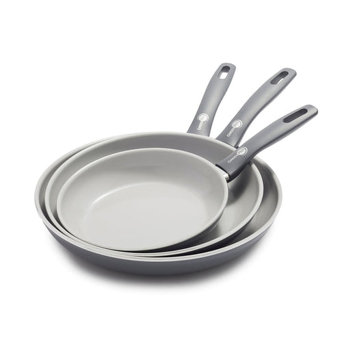 Set of three ceramic nonstick frypans in different sizes, stacked with handles overlapping.