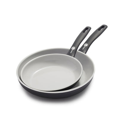 Two black ceramic nonstick frypans, 8-inch and 10-inch, stacked together on a white background.
