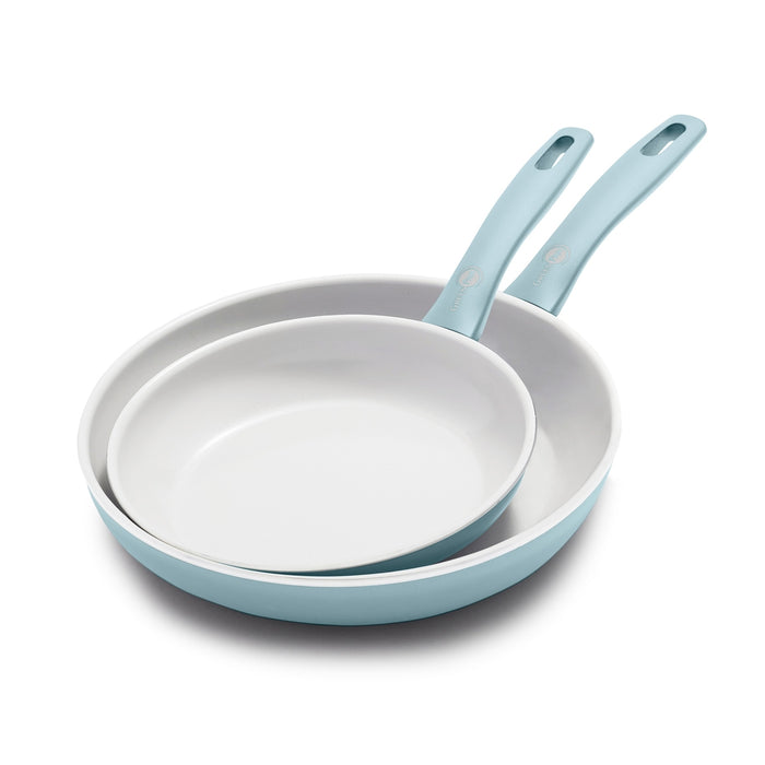 Two blue frypans with white interiors, stacked on a white background. Set includes 8-inch and 10-inch sizes.
