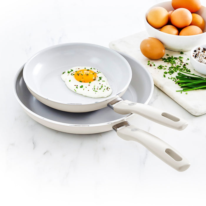 Cream white ceramic nonstick frypan set, includes 8-inch and 10-inch pans shown side by side.