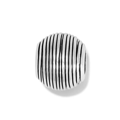 Brighton charm bead with ribbed silver-plated grooved texture in a rounded barrel shape on a white background